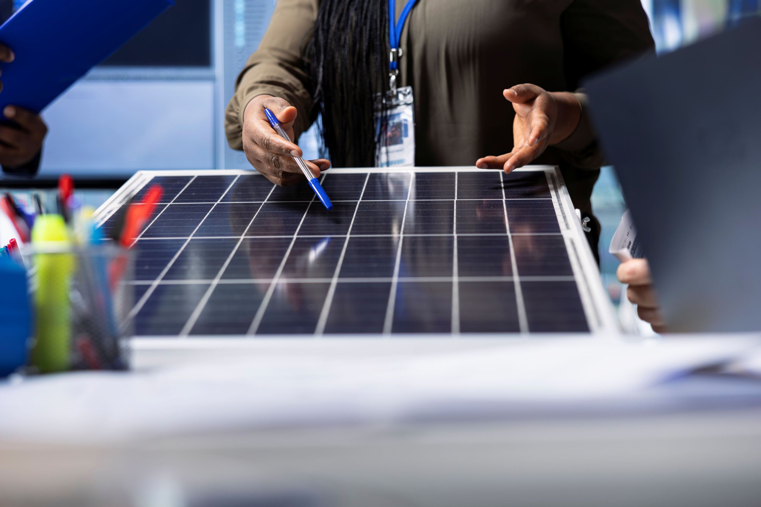 expert-reviewing-solar-panel-design-close-up